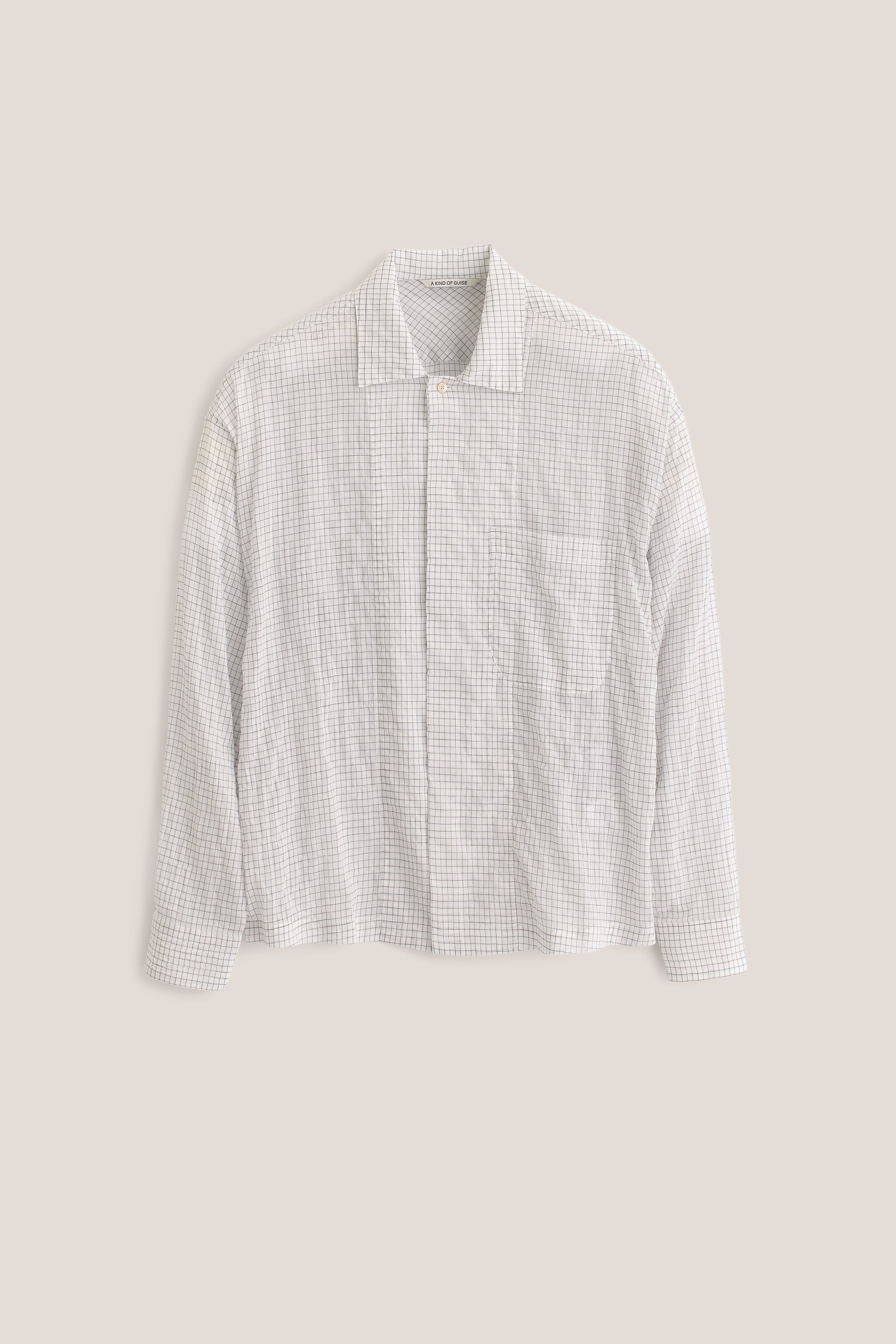 Men's long-sleeved shirt, cotton yarn-dyed check, white, with spread collar, patch pocket, and partially hidden placket.
