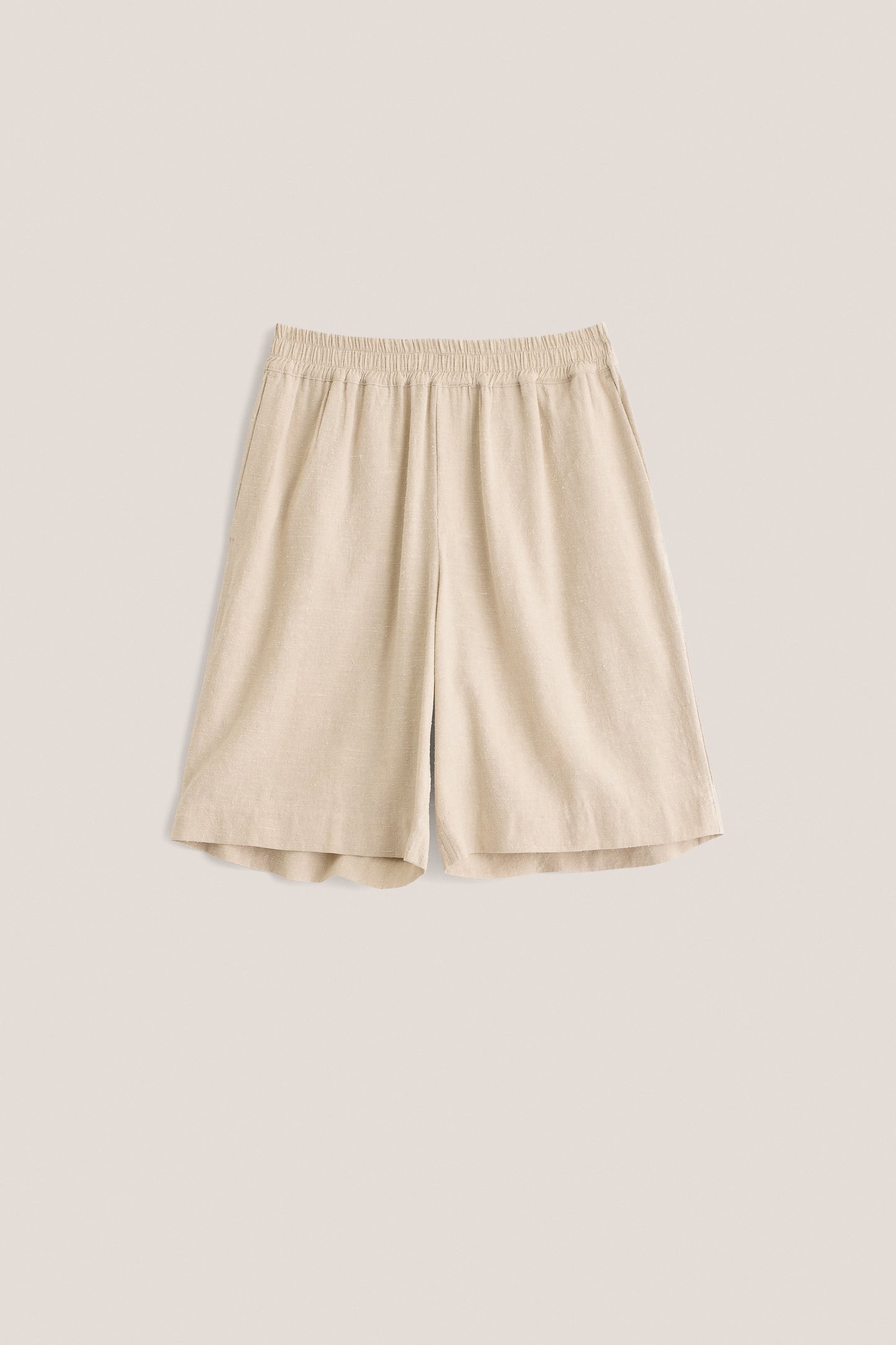 Unisex shorts, linen-silk blend, undyed natural beige, wide leg, elastic waist, side pockets.