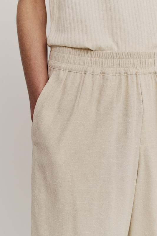Unisex shorts, linen-silk blend, naturally textured, undyed beige, elastic waist, wide leg, side pockets.