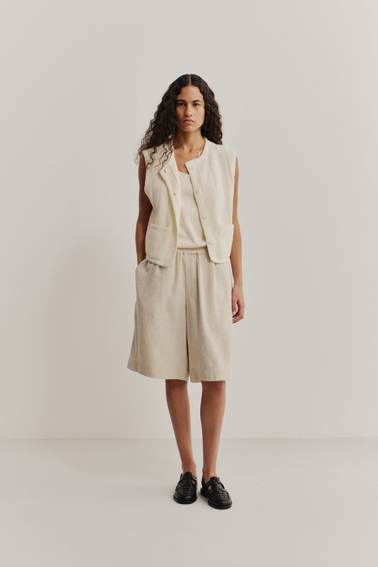 Unisex shorts, linen and silk blend, naturally textured, undyed, unbleached, relaxed fit, wide leg, elastic waist, side pockets, patch pocket, natural.