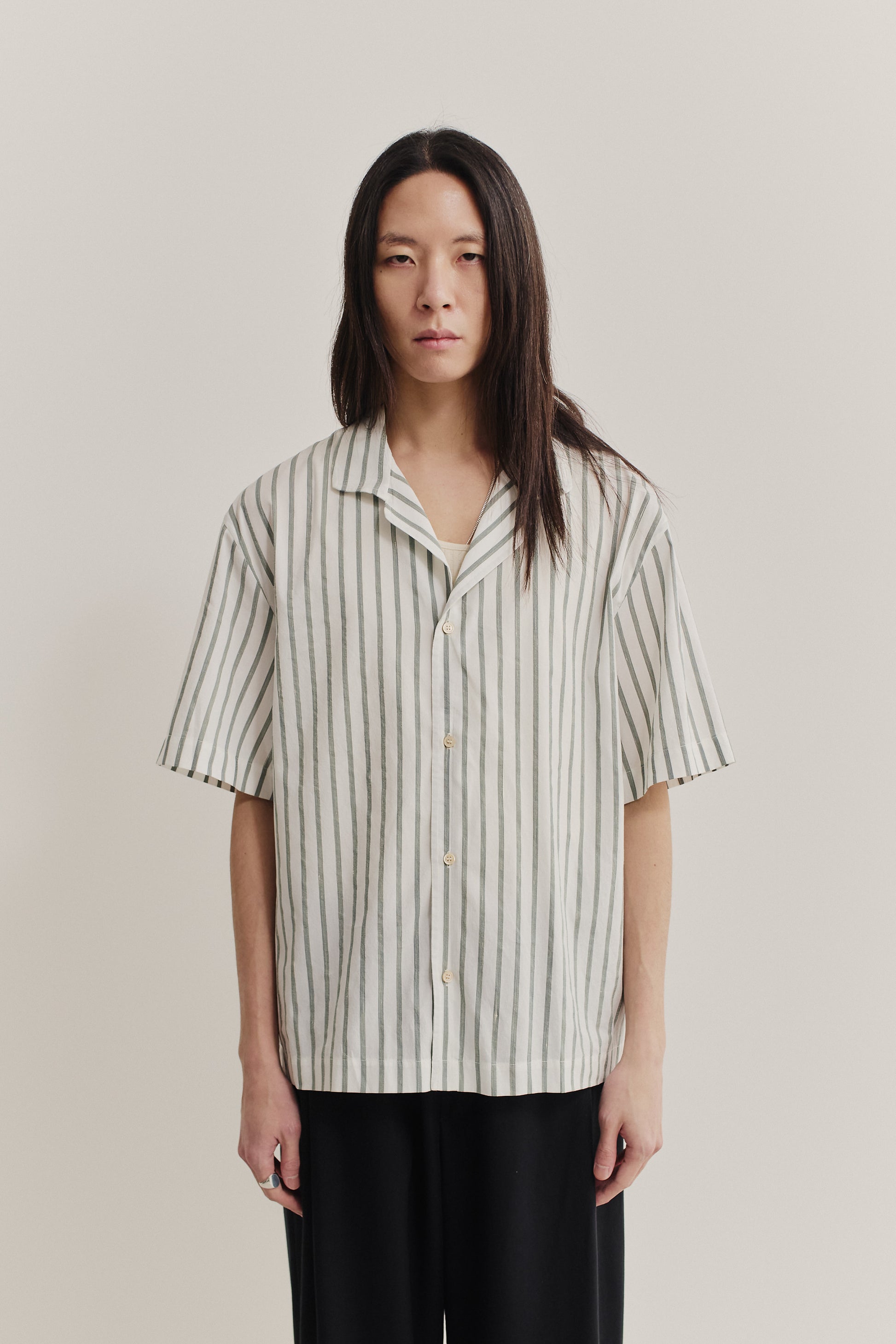 Men's short-sleeved shirt, cotton-silk-linen blend, washed finish, white with subtle green stripes.