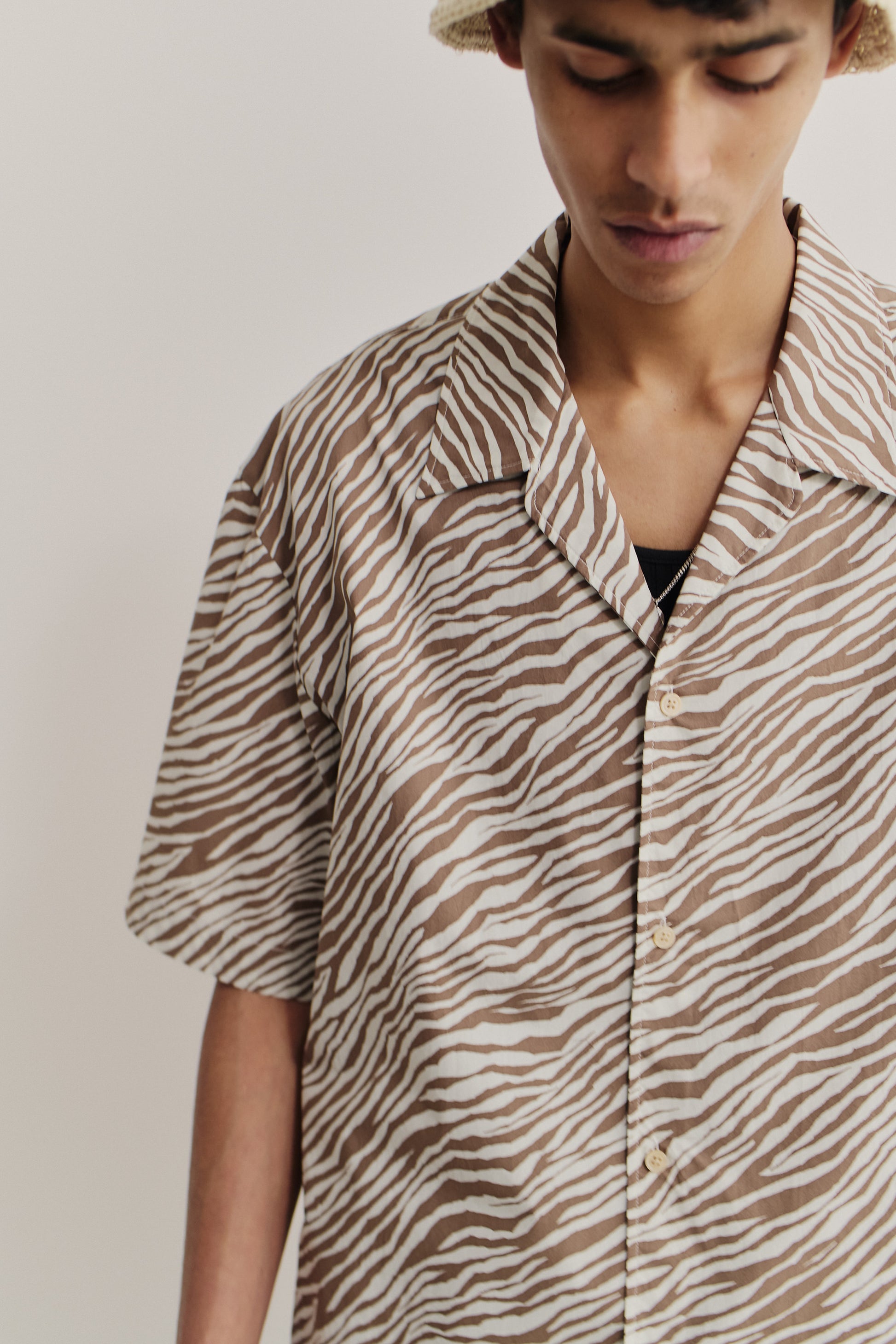 Men's short-sleeved shirt, cotton blend, fluid zebra-inspired stripe pattern, brown and white.