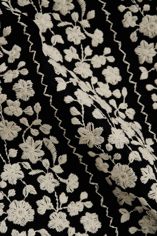 Men's short-sleeved shirt, 100% cotton, black with white embroidered floral blocks and wavy lines.