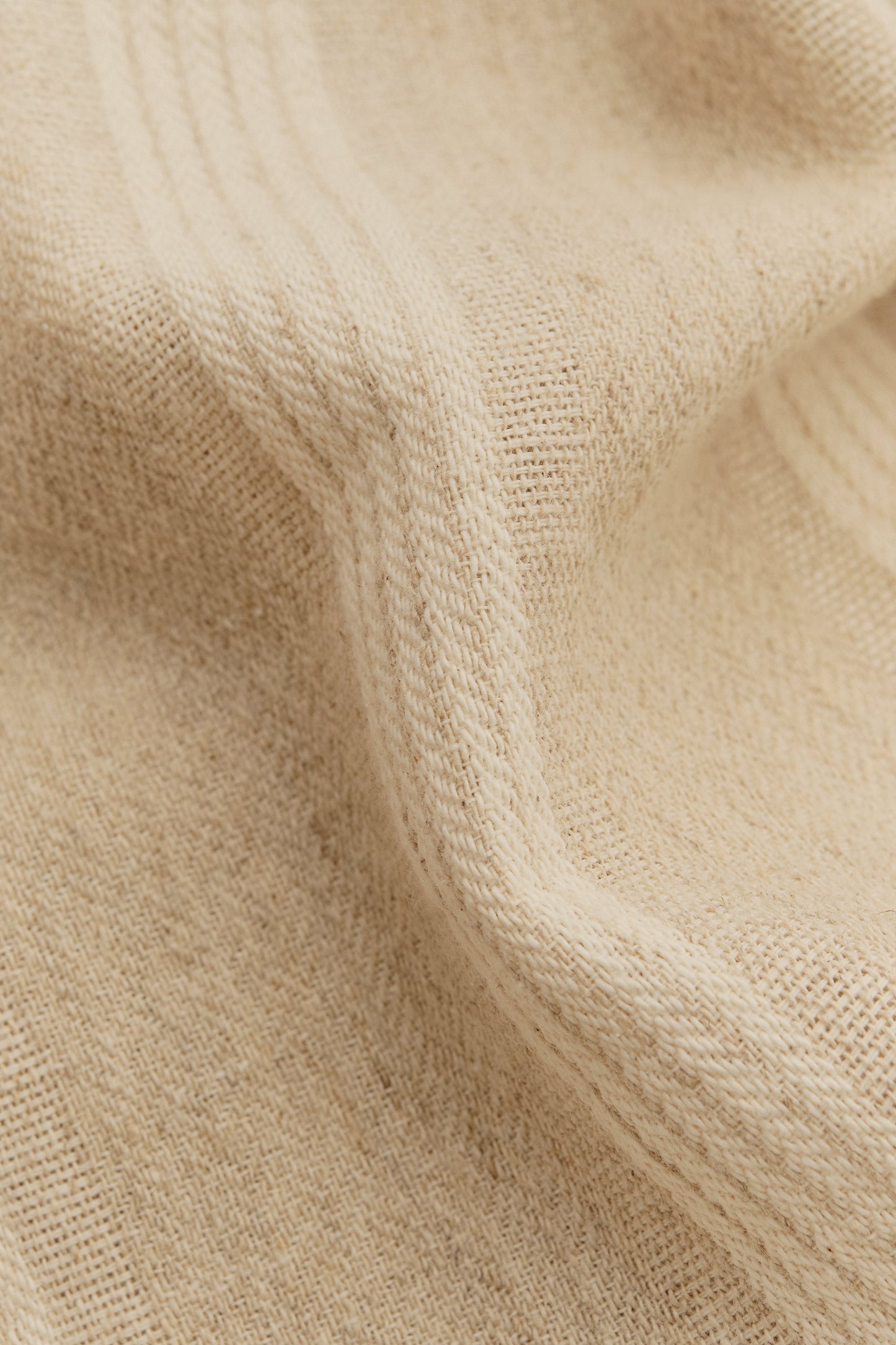 Men's short-sleeved shirt, recycled cotton-linen blend, herringbone weave, soft brown with off-white stripes.