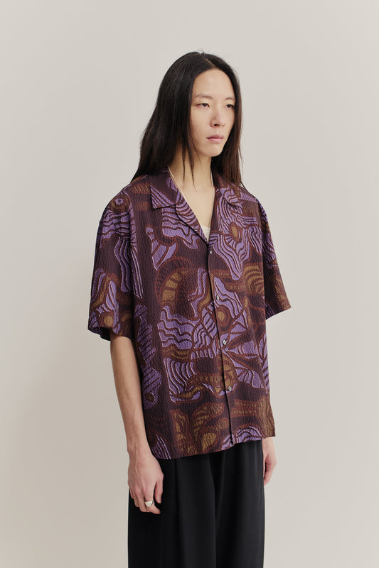 Men's short-sleeved shirt, cotton seersucker, brown and purple African wildlife print.