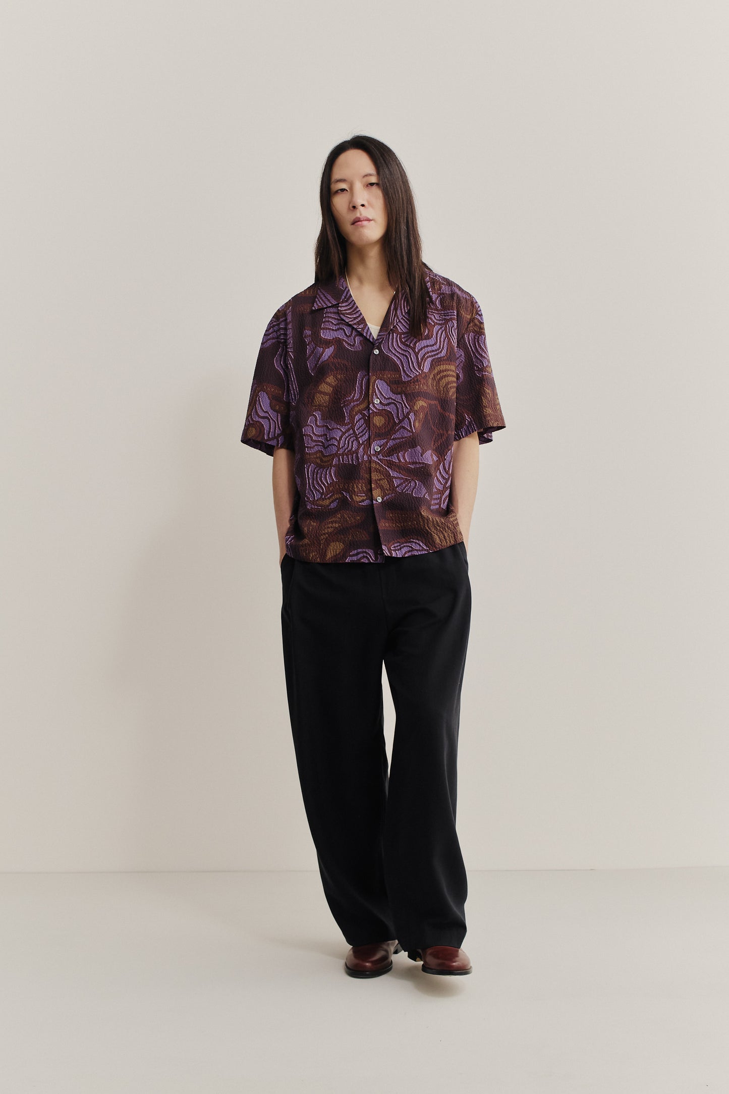 Men's short-sleeved shirt, cotton seersucker, brown and purple African wildlife print, notched collar.