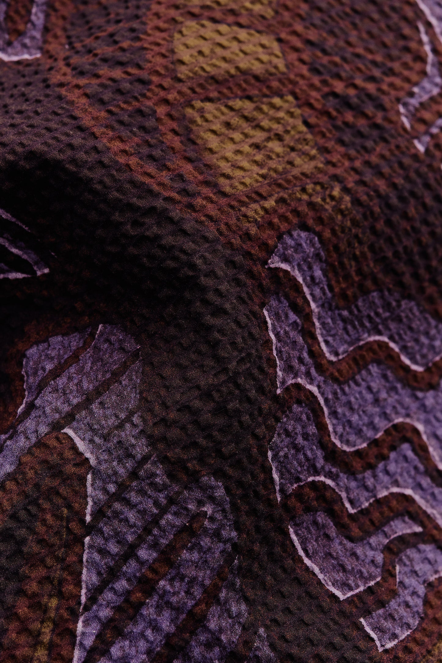 Men's short-sleeved shirt, cotton seersucker, dark brown with purple and yellow African wildlife print.