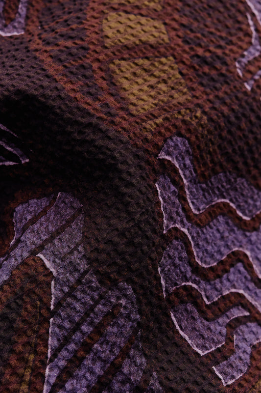 Men's short-sleeved shirt, cotton seersucker, dark brown with purple and yellow African wildlife print.
