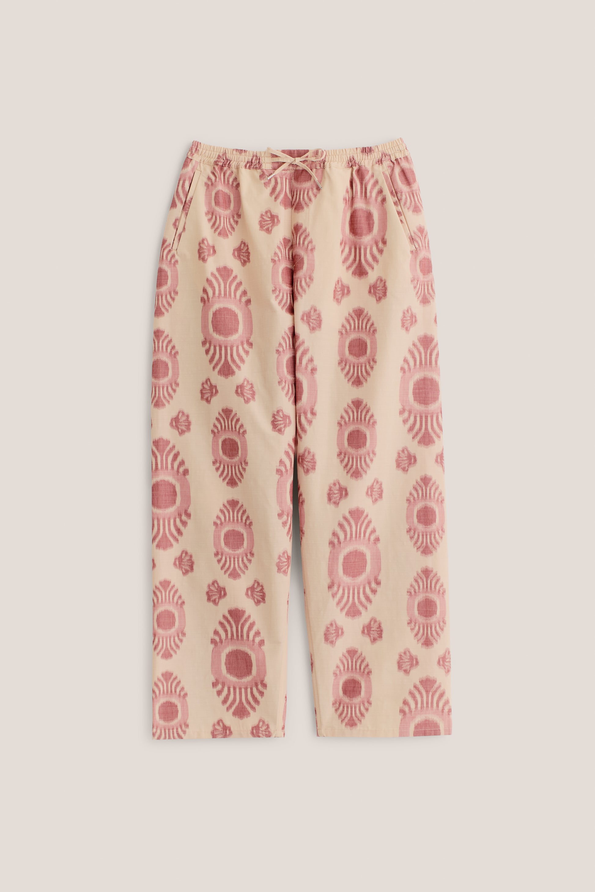 Men's long-pants, cotton and recycled polyester blend, ikat print, beige with red pattern, elastic waist.