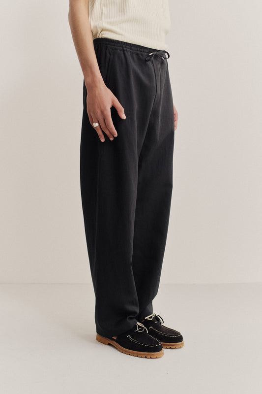 Men's long pants, black worsted wool and linen blend, wide straight fit, elasticated waist.