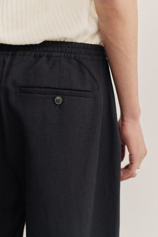 Men's pants, long-pants, worsted wool and linen blend, dark navy, with elasticated waistband and buttoned welt pocket.