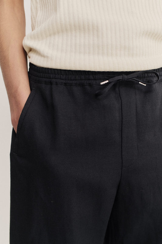 Men's long-pants, worsted wool and linen blend, black, with elasticated waistband and drawstring.