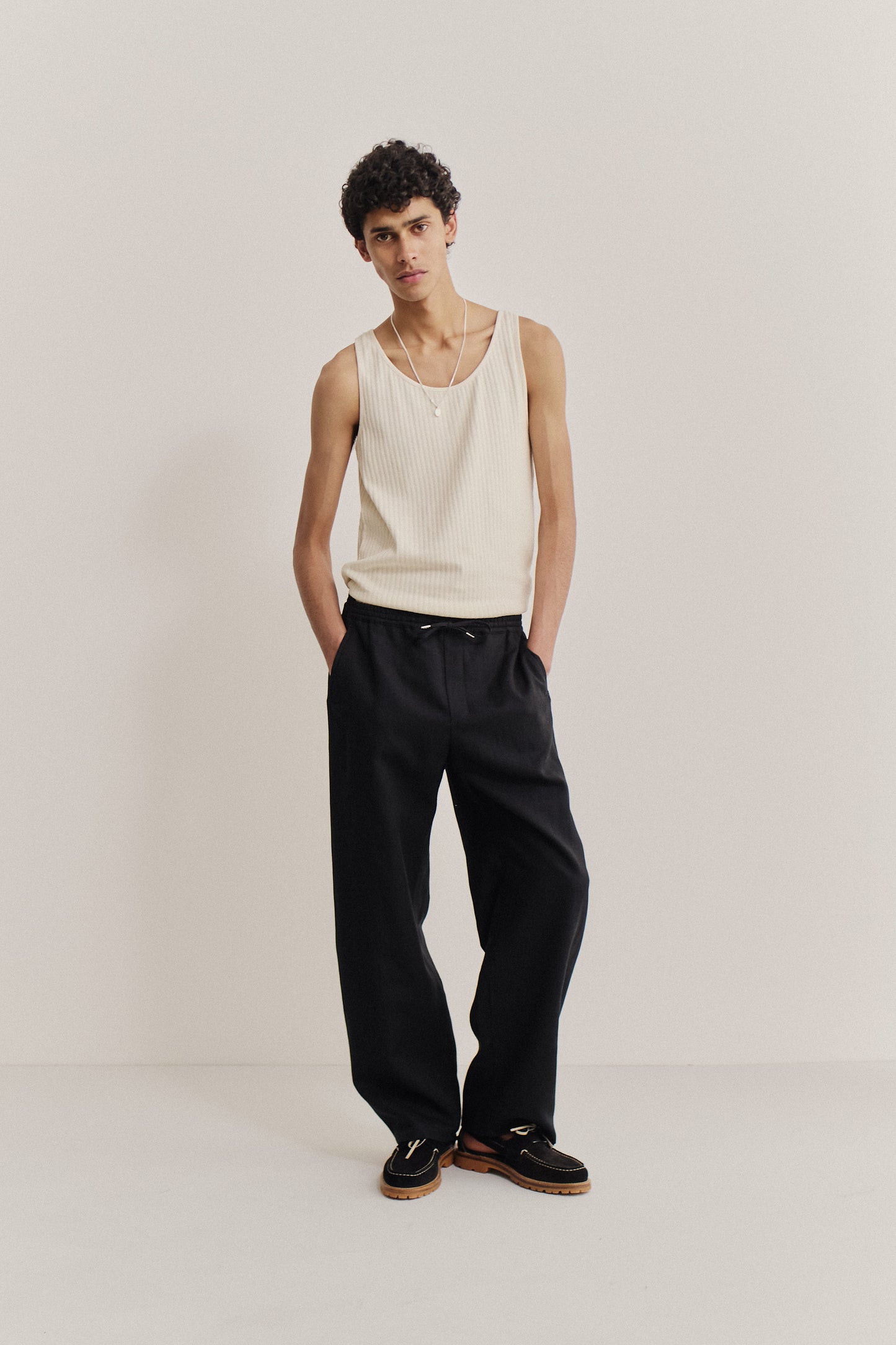 Men's long-pants, worsted wool and linen blend, black, wide straight fit, elasticated waistband, welt pockets.