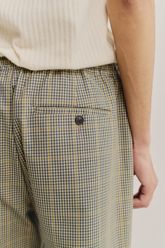 Men's long-pants, cotton houndstooth in navy, green, and beige, with a back welt pocket.