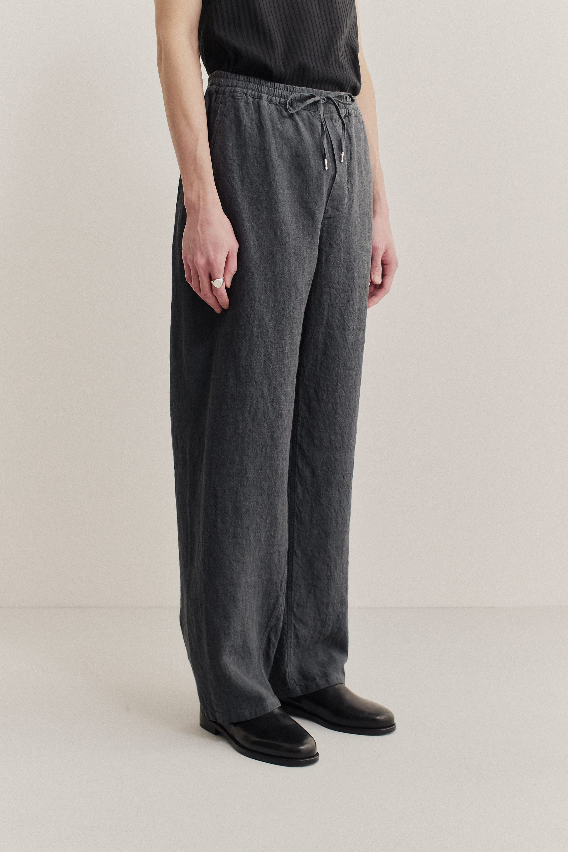 Men's long-pants, 100% linen, vintage-like texture, charcoal, with elastic waist and relaxed leg.
