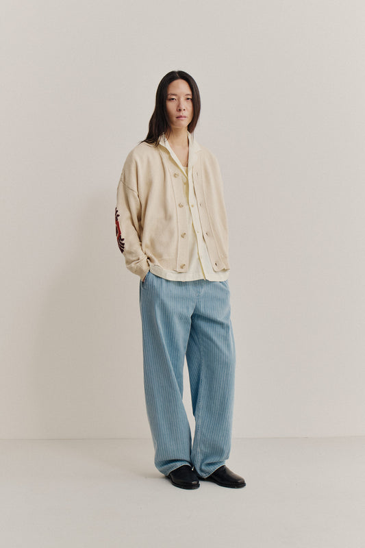 Men's long-pants, organic cotton washed light blue denim with subtle white pinstripes, wide straight fit.