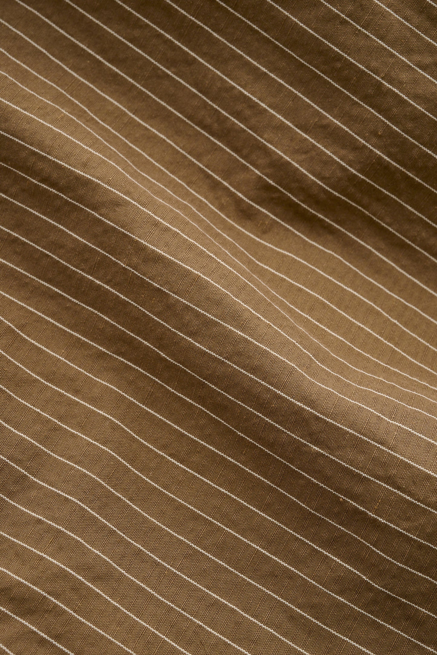Men's long-pants, cotton-linen seersucker, brown with fine pinstripes.