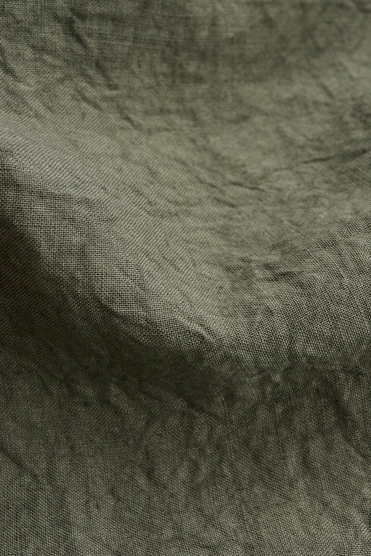 Men's long pants, Japanese linen, sun-dried, olive green, with subtle natural texture.
