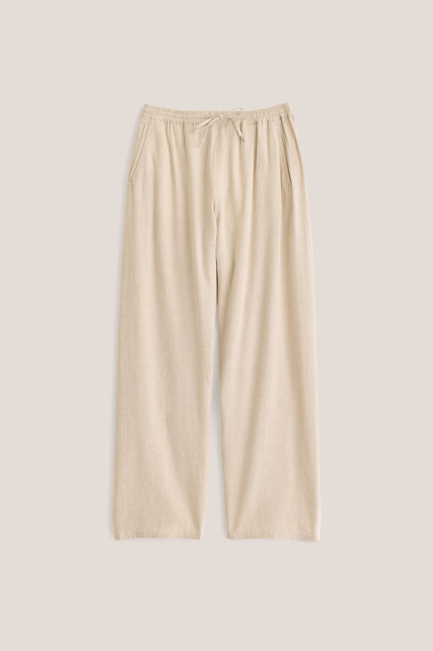 Unisex long-pants, linen silk blend, naturally textured, undyed beige, elasticated waist, wide straight fit.