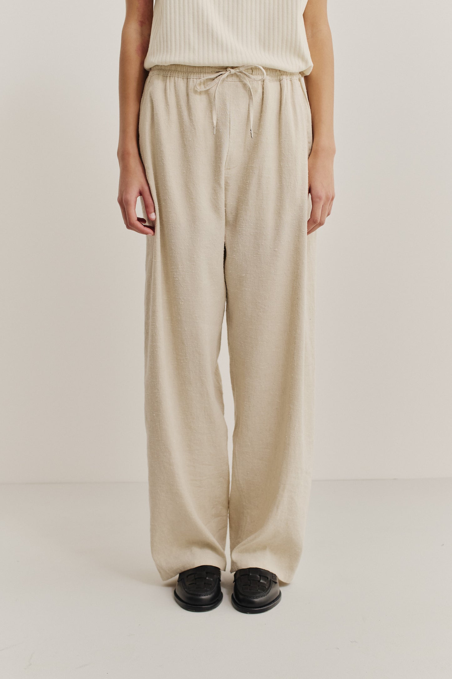 Unisex long-pants, linen-silk blend, naturally textured, undyed, unbleached, with elastic waist and wide leg.