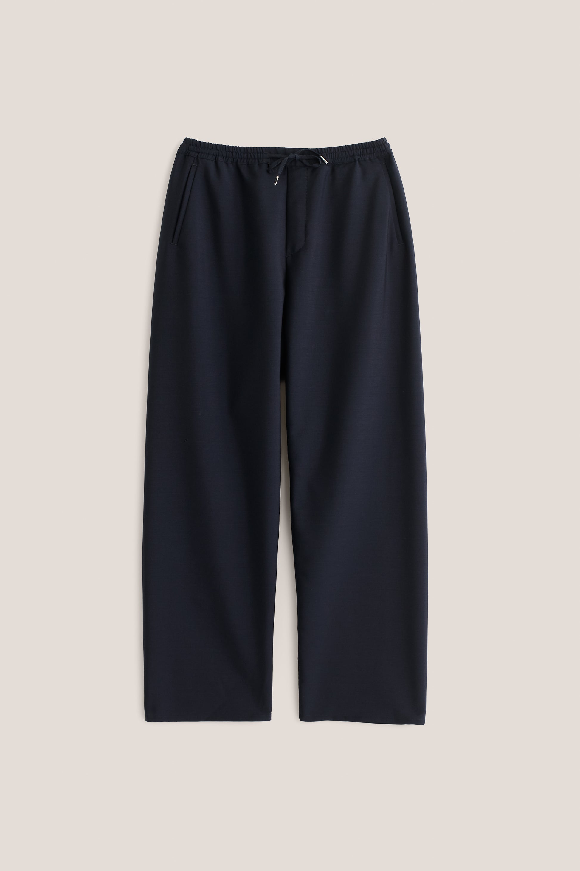 Unisex long-pants, 100% virgin wool, dark navy, wide straight fit, elasticated waistband, welt pockets.