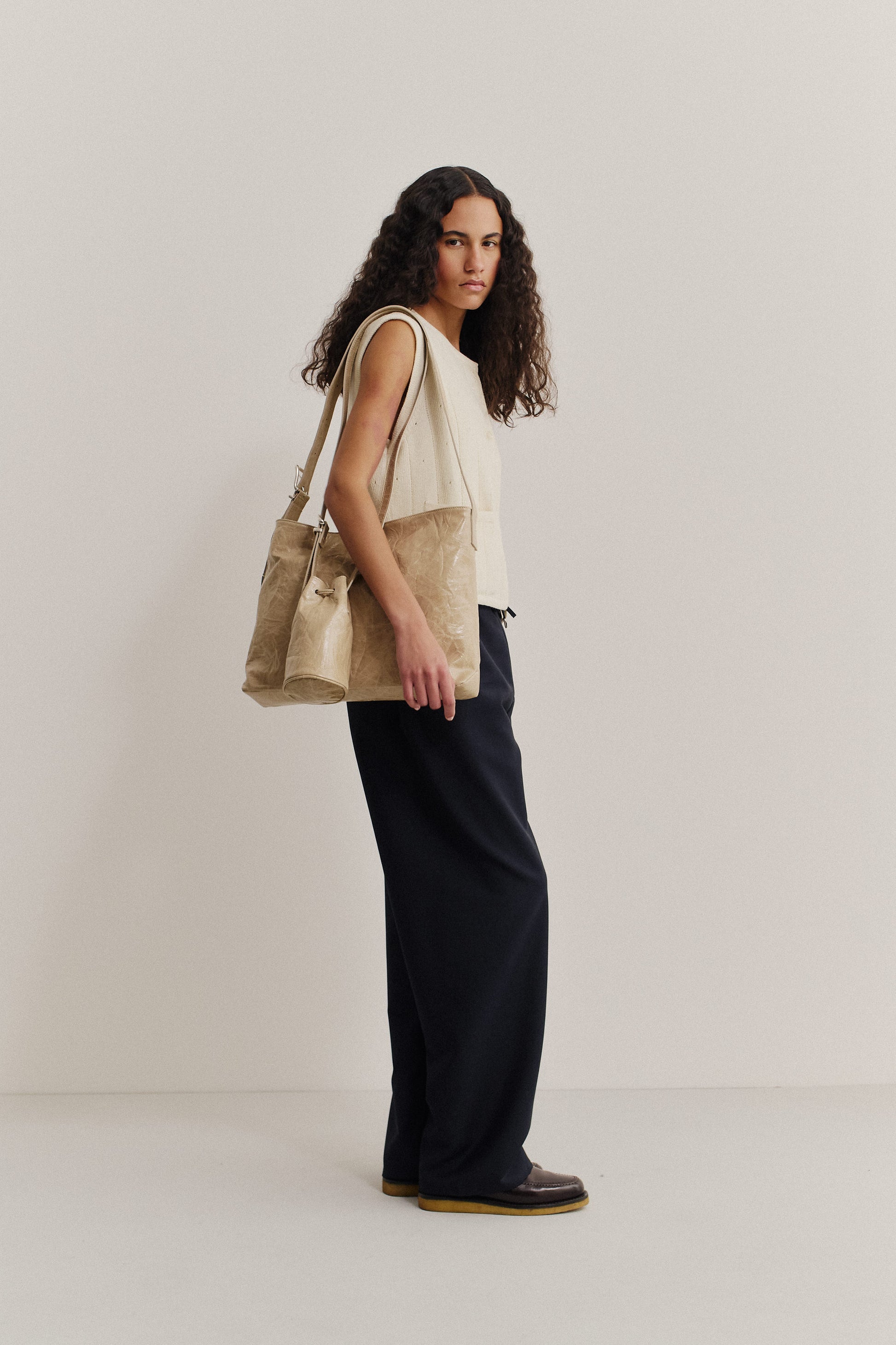 Women's long-pants, 100% virgin wool, dark navy, wide straight fit, elasticated waistband, and welt pockets.