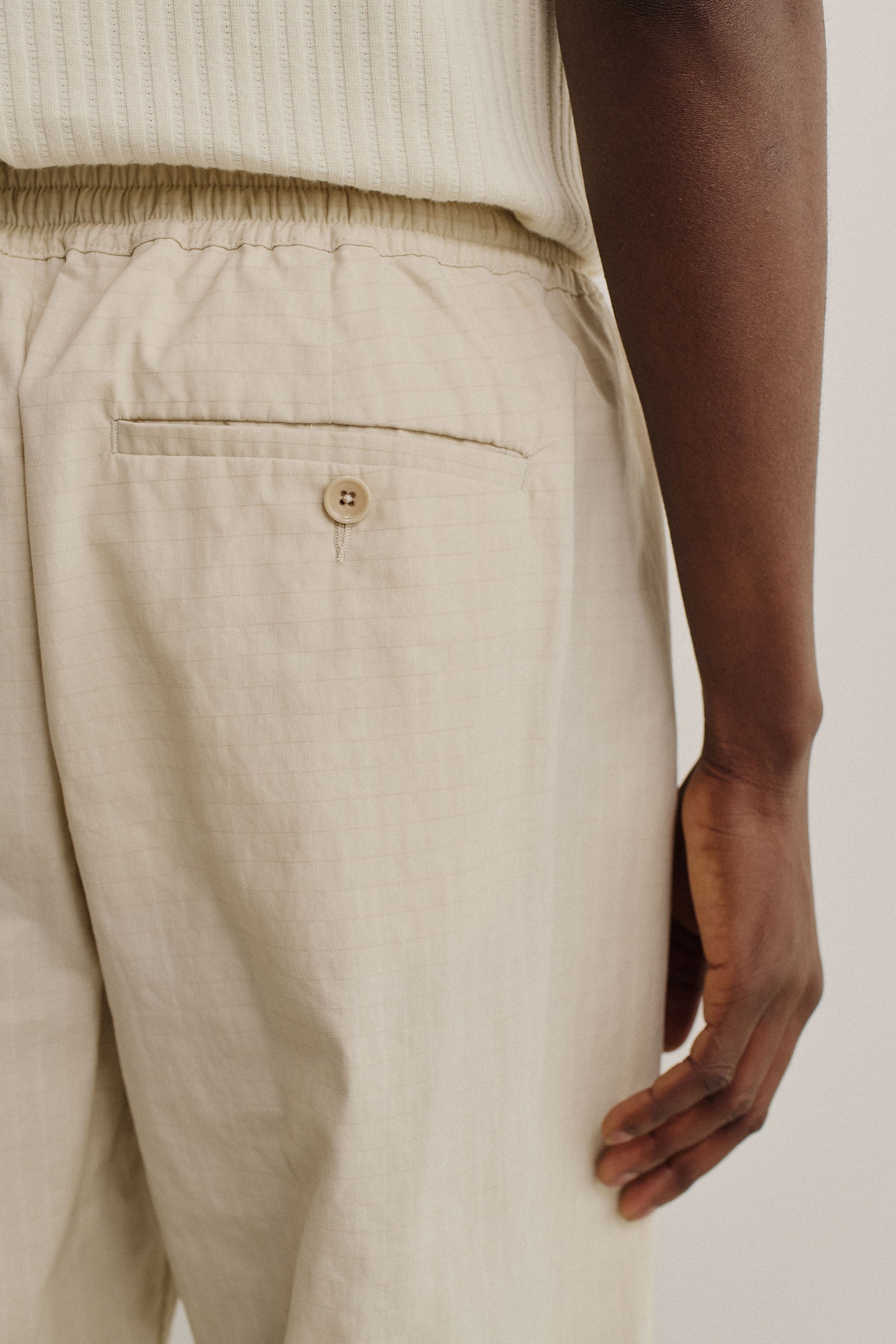 Men's long pants, cotton blend ripstop, beige, with elasticated waist and back welt pocket.