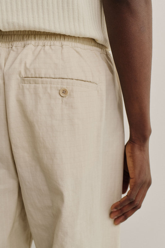 Men's long pants, cotton blend ripstop, beige, with elasticated waist and back welt pocket.