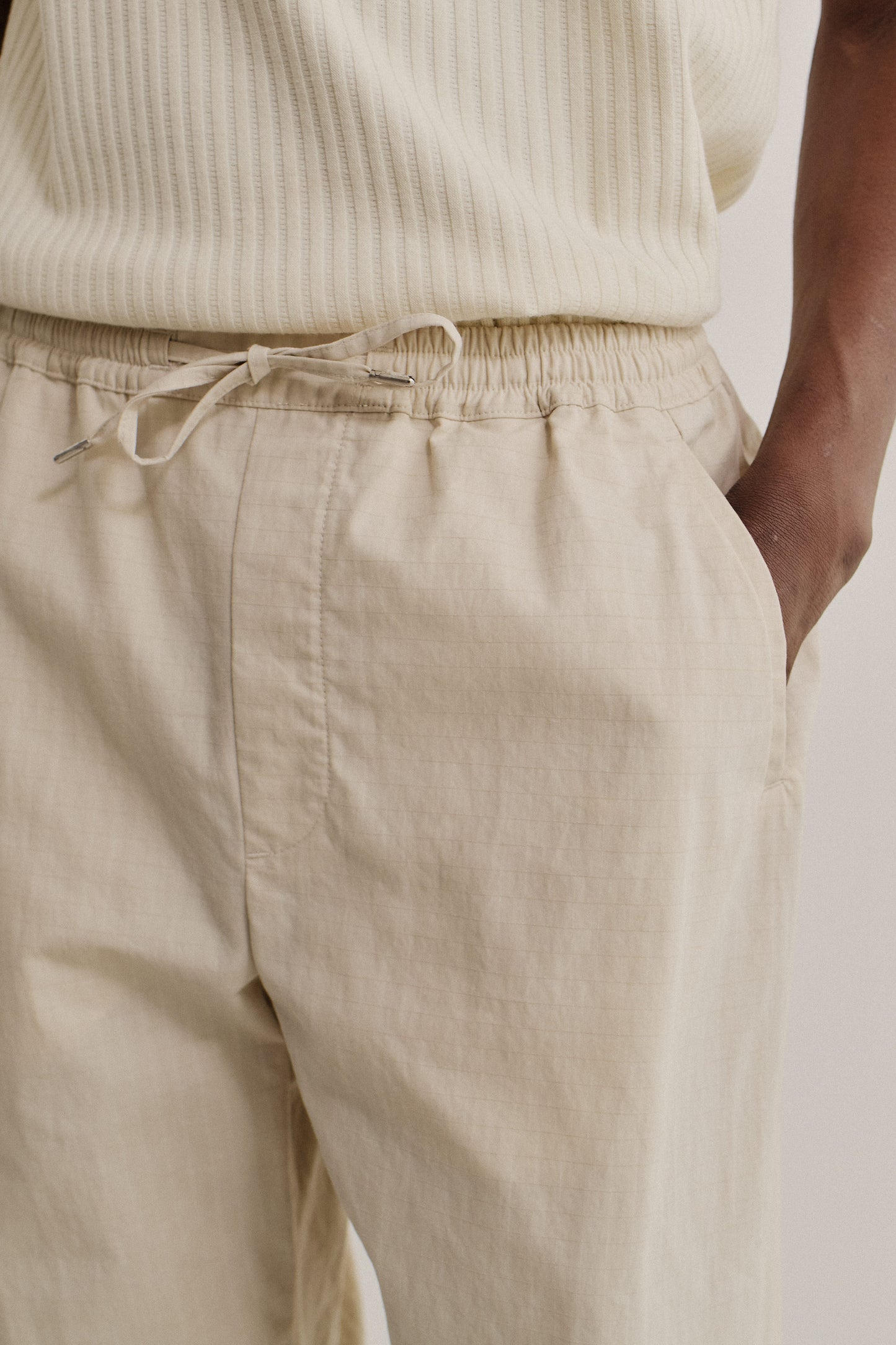 Men's long pants, cotton blend ripstop, beige, with elasticated waistband and drawstrings.