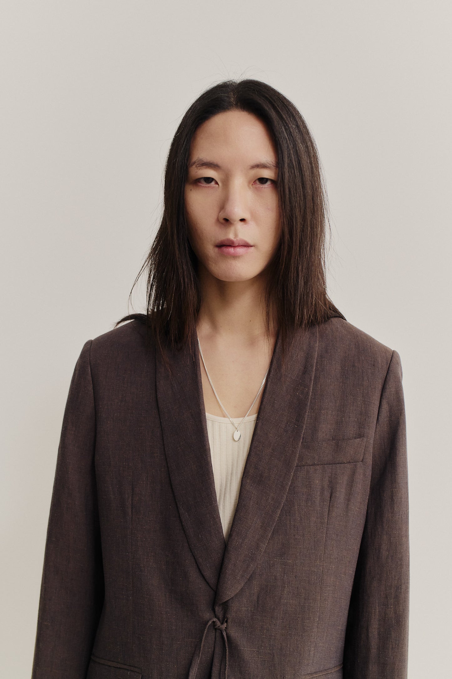 Men's tailoring blazer, 100% linen, burnt umber, with shawl collar and kimono-inspired cord closure.