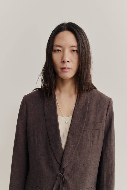 Men's tailoring blazer, 100% linen, burnt umber, with shawl collar and kimono-inspired cord closure.