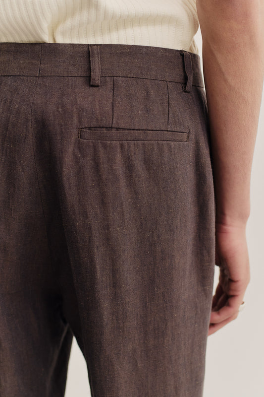 Men's long-pants, tailored wide-leg linen, canvas weave, brown, with a single back welt pocket.