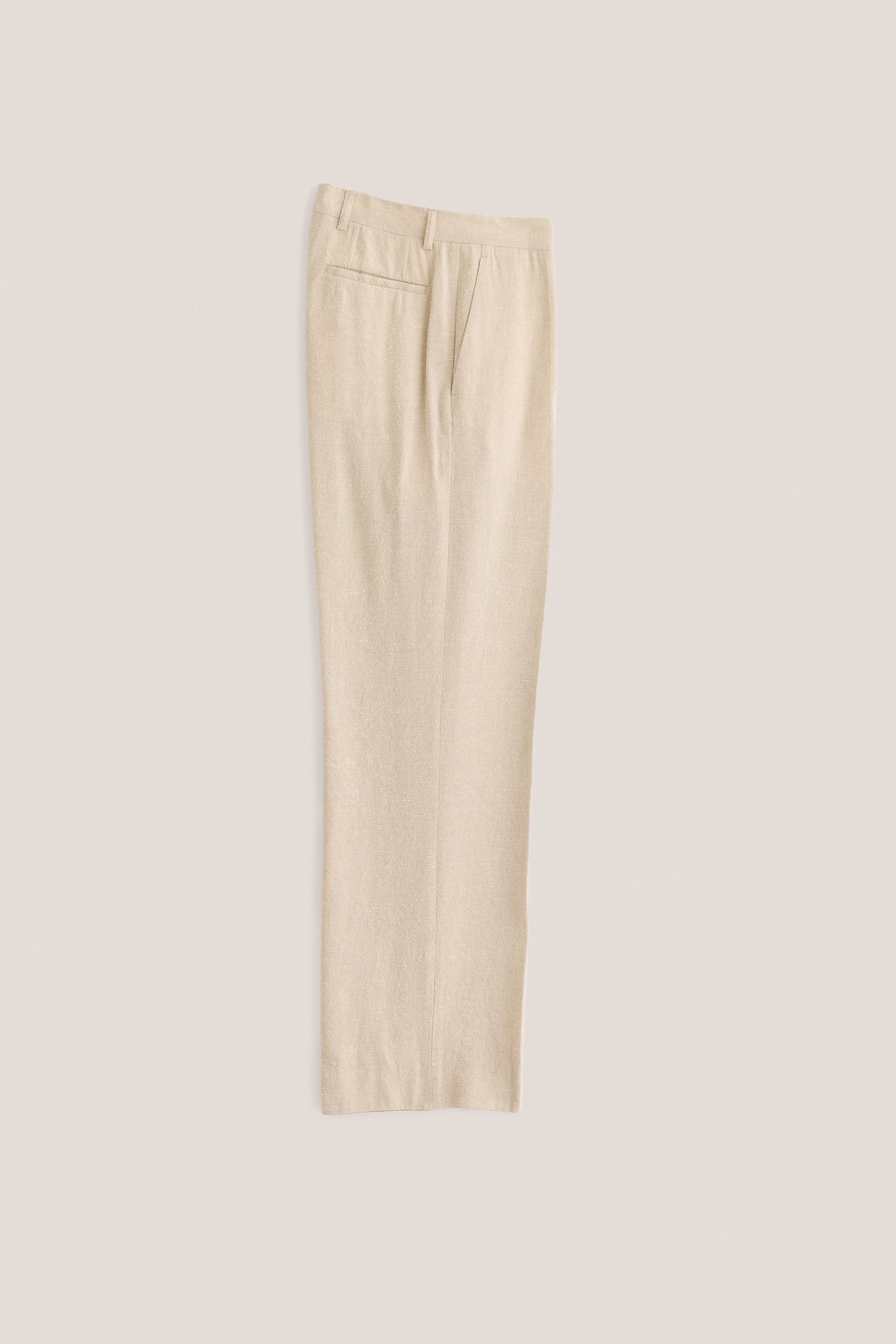Men's long-pants, linen-silk blend, naturally textured, undyed beige, tailored wide-leg with pressed pleat.