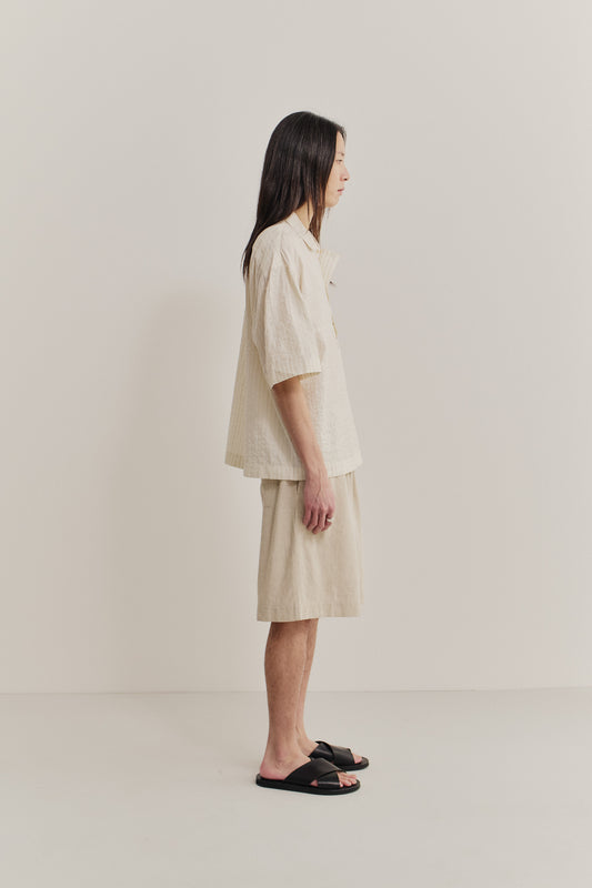 Men's short-sleeved shirt, cotton-silk-linen blend, washed, cream with subtle stripes.