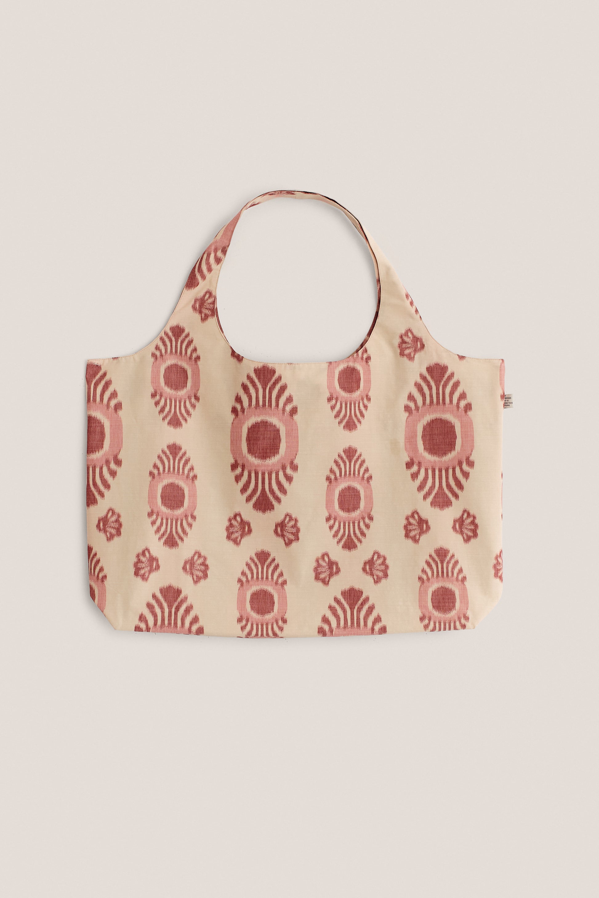 Women's accessories bag, cotton and recycled polyester blend, lightweight, beige with red ikat pattern.