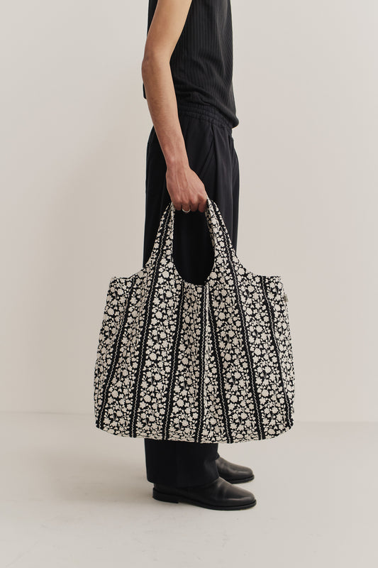 Women's accessories bag, cotton, black with white embroidered flower blocks and wavy lines.