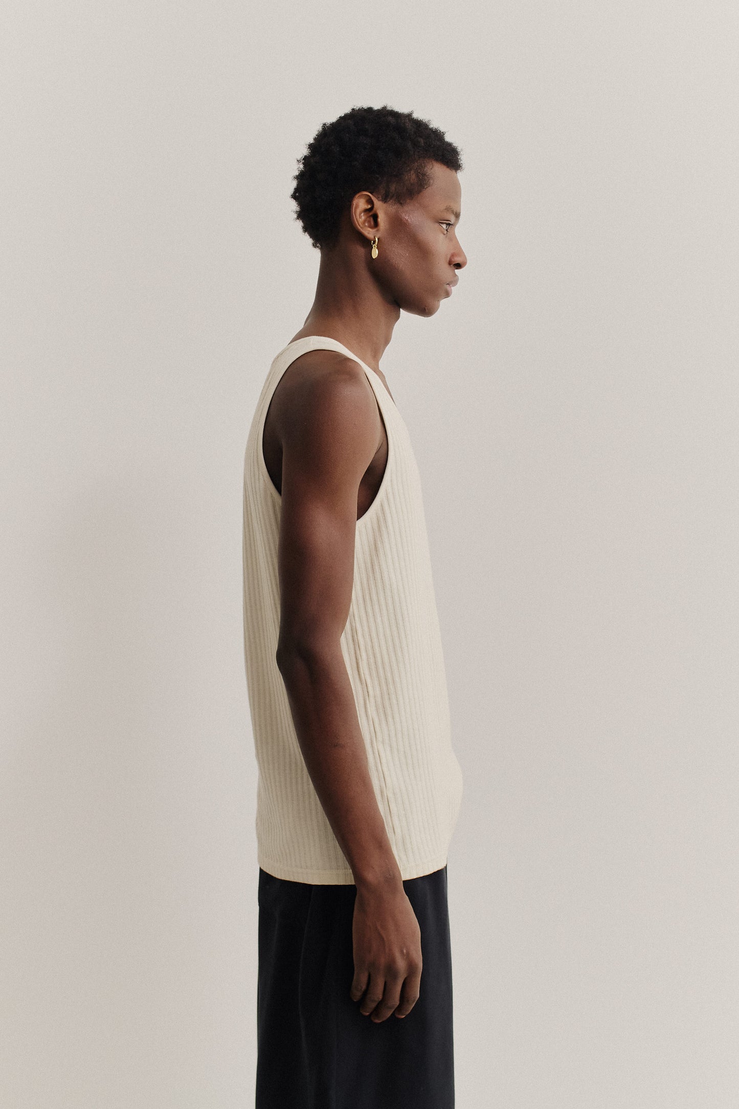 Unisex jersey tanktop, off-white cotton rib with delicate openwork, relaxed fit.