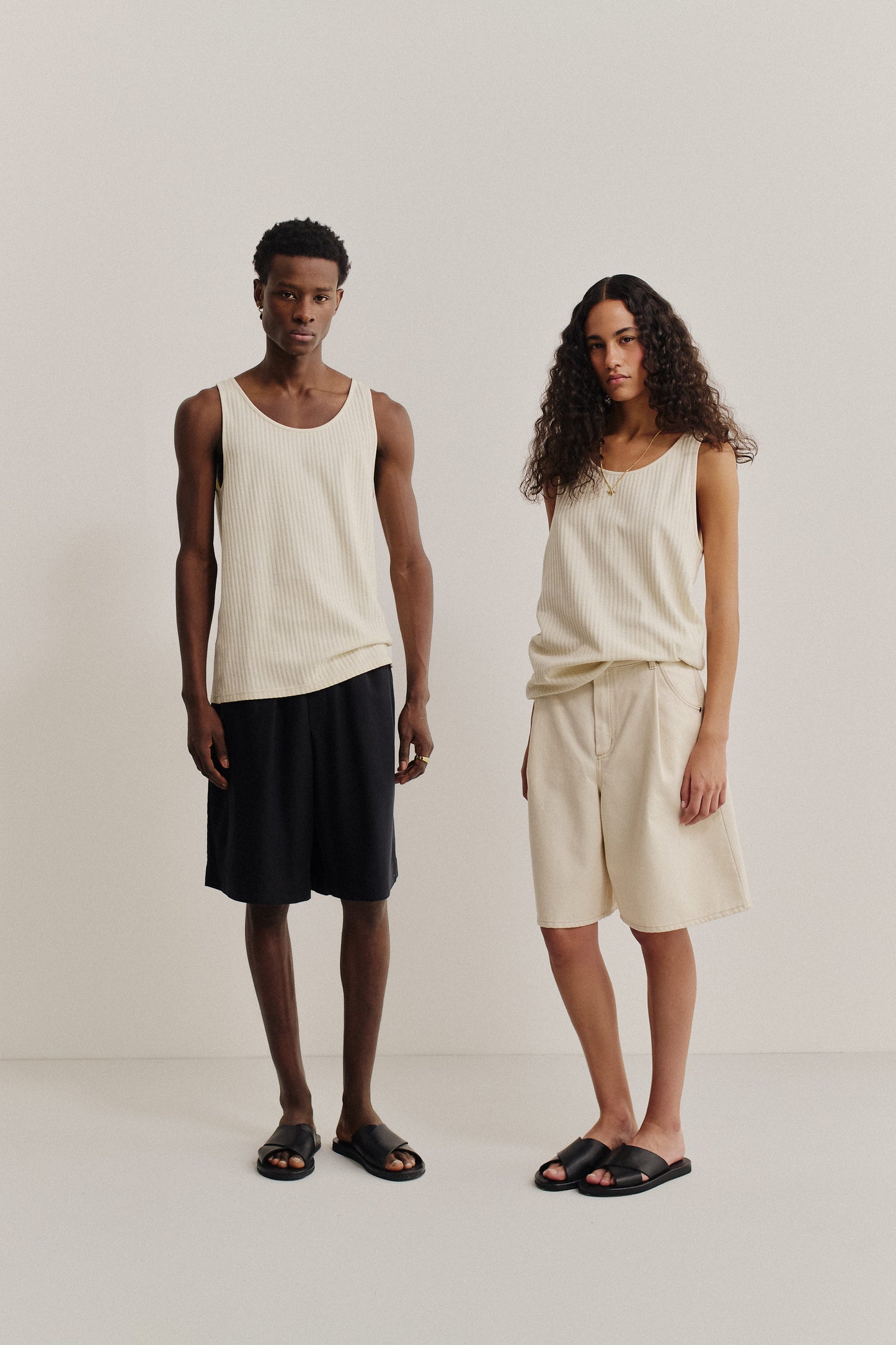 Unisex jersey tanktop, off-white cotton rib with pointelle detailing, relaxed fit.