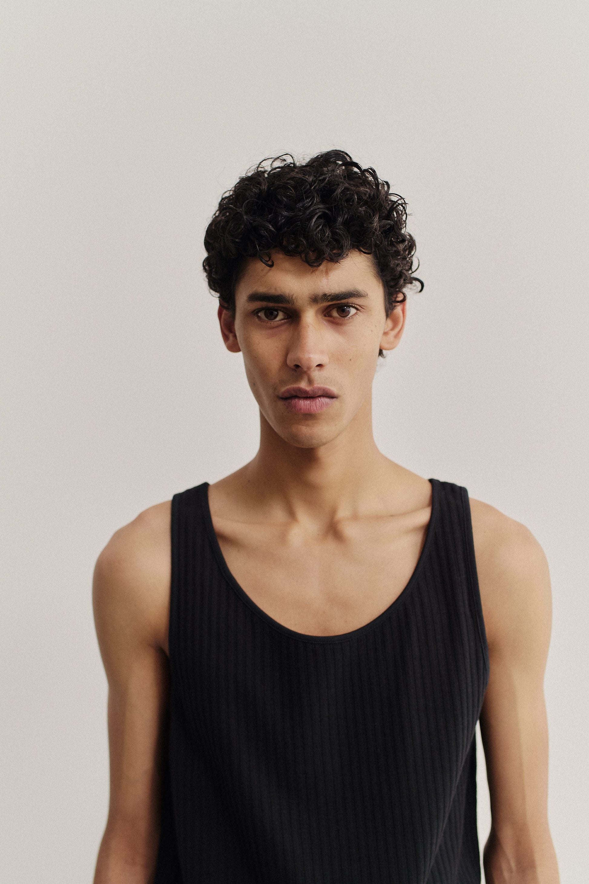 Men's jersey tanktop, cotton mix, garment dyed, black, with rib structure and pointelle detailing.