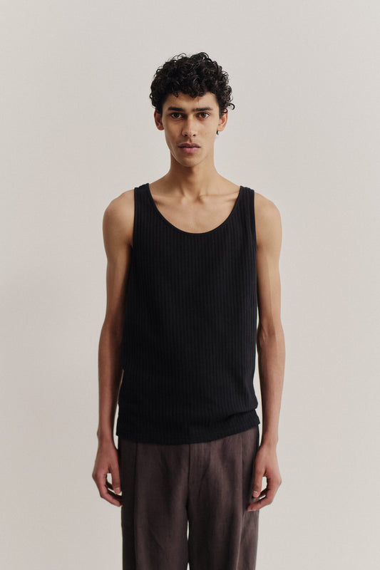 Men's jersey tanktop, cotton mix, garment dyed black, ribbed with pointelle detailing.