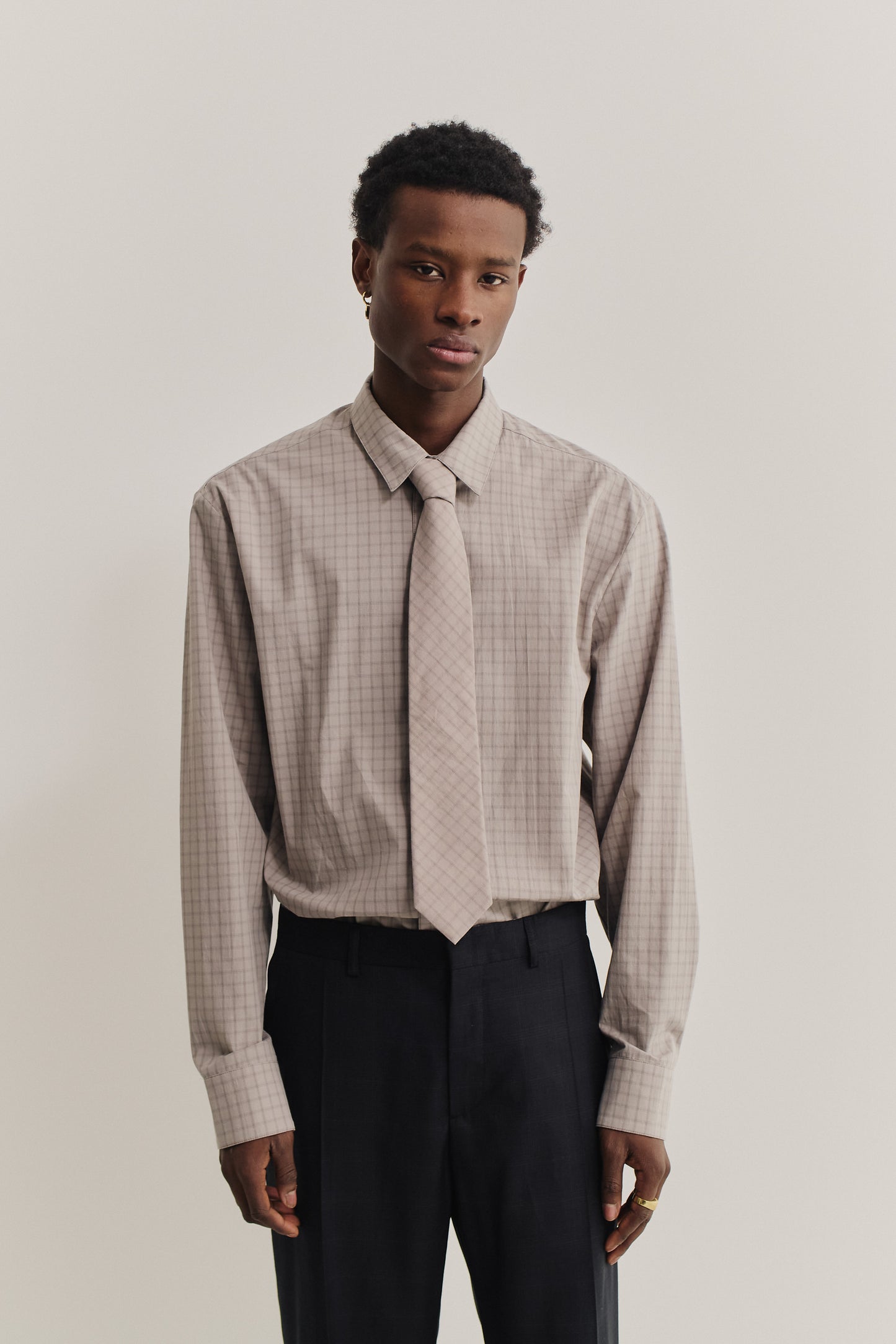 Men's accessories, cotton tie, light grey with dark grey squared check pattern.