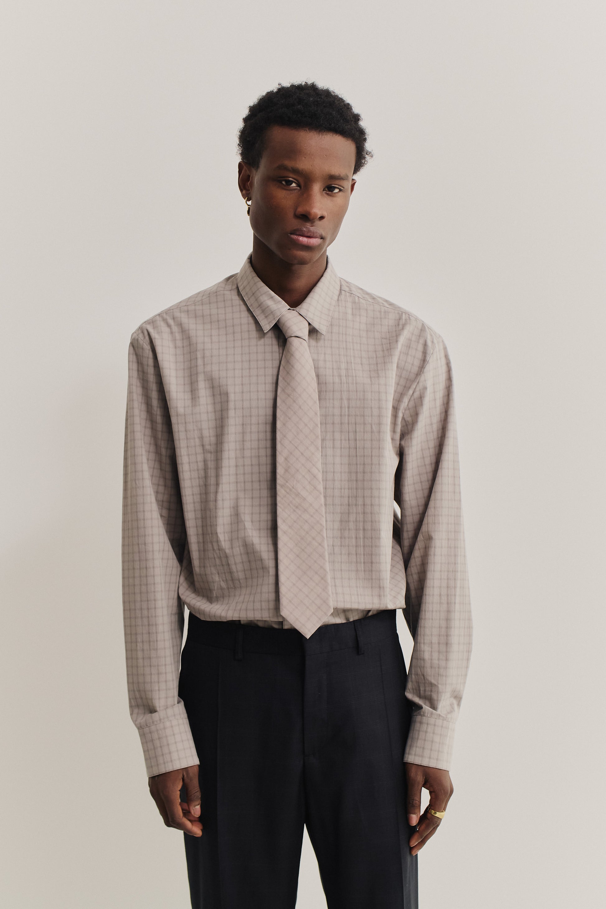 Men's accessories, cotton tie, light grey with dark grey squared check pattern.