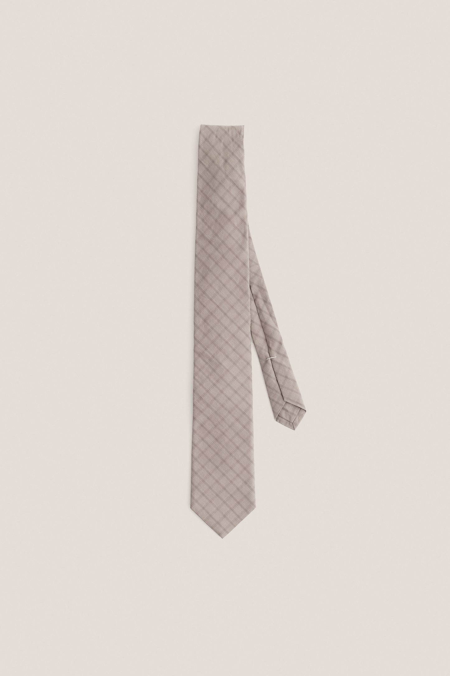 Men's accessories tie, organic cotton, light grey with dark grey squared check pattern.