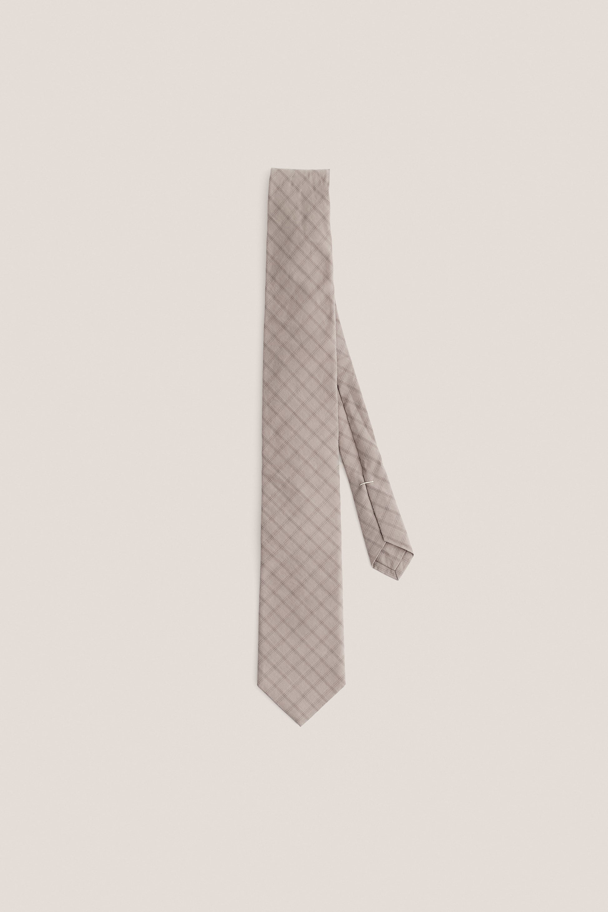Men's accessories tie, organic cotton, light grey with dark grey squared check pattern.
