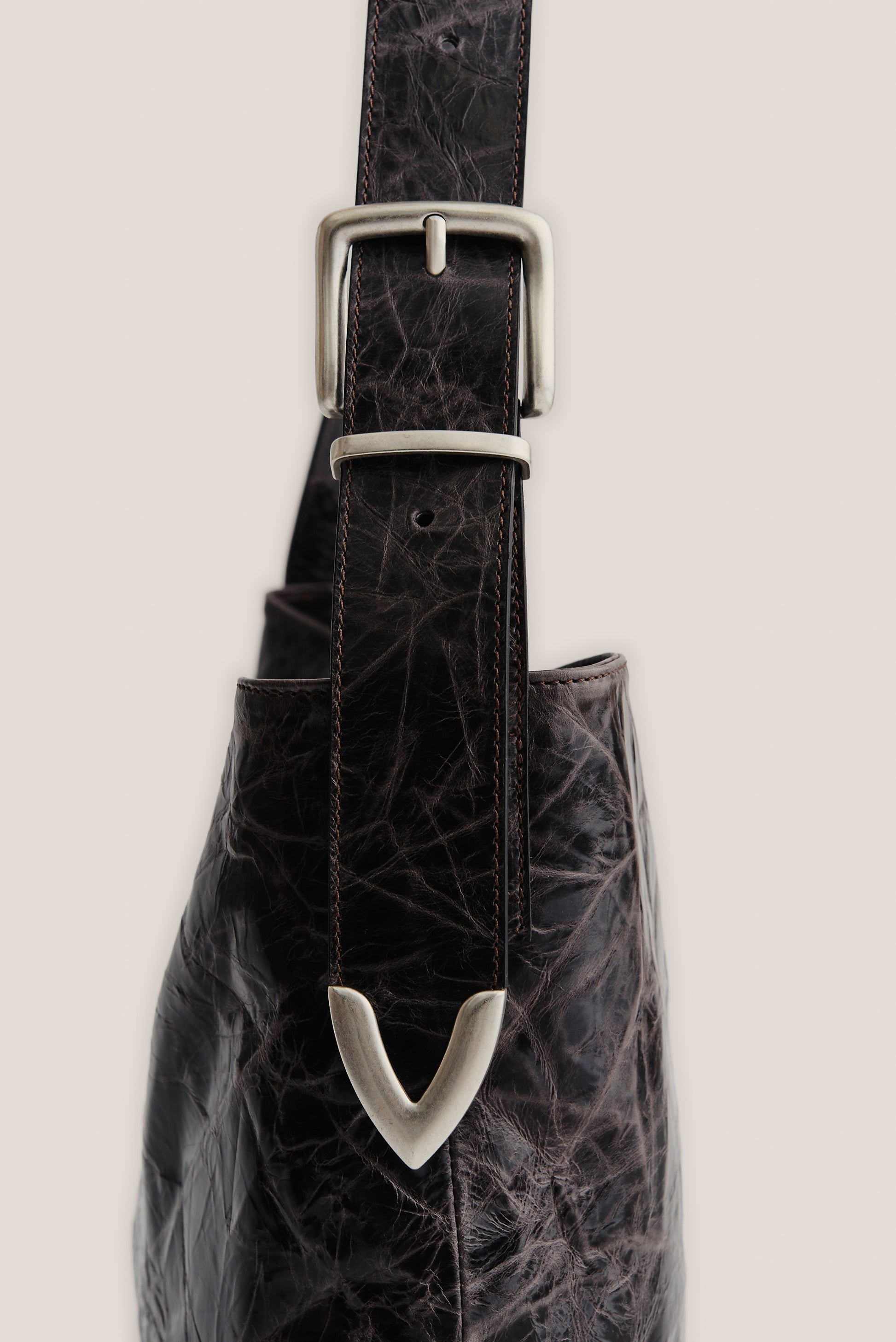 Men's accessories leather messenger bag with adjustable belt buckle strap, dark brown LWG-certified calf leather.