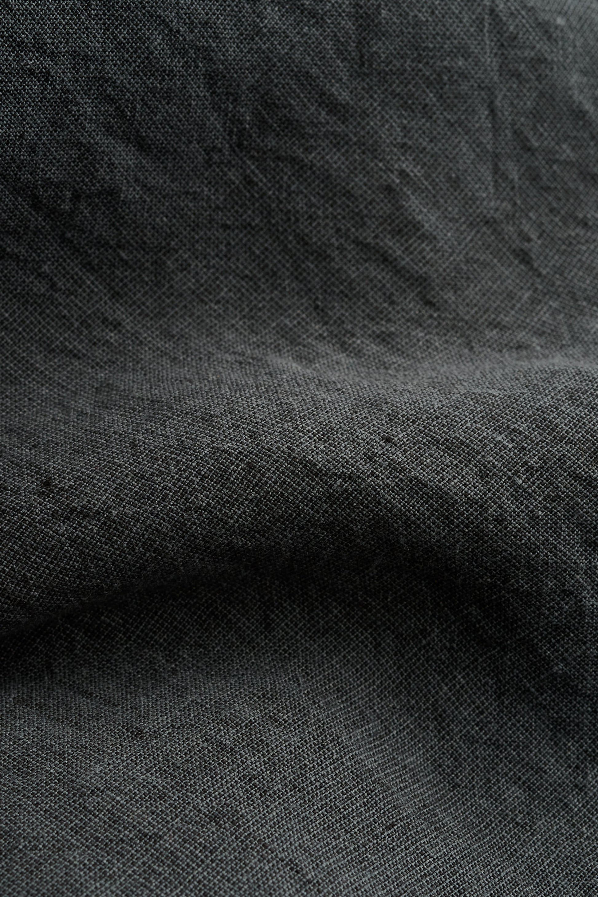 Men's shorts, linen, vintage-like texture, dark grey.