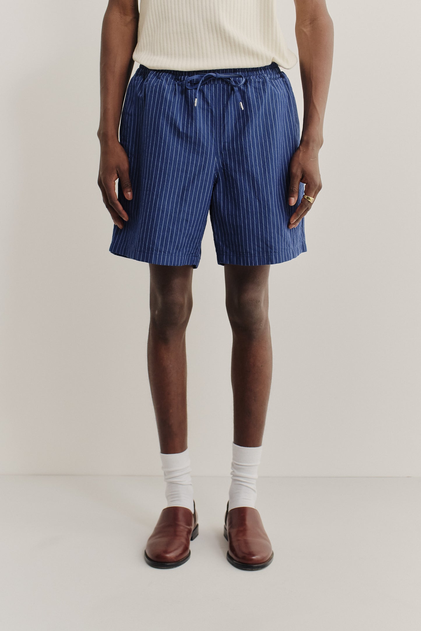 Men's shorts, cotton-linen seersucker, navy with white pinstripes, adjustable waistband.