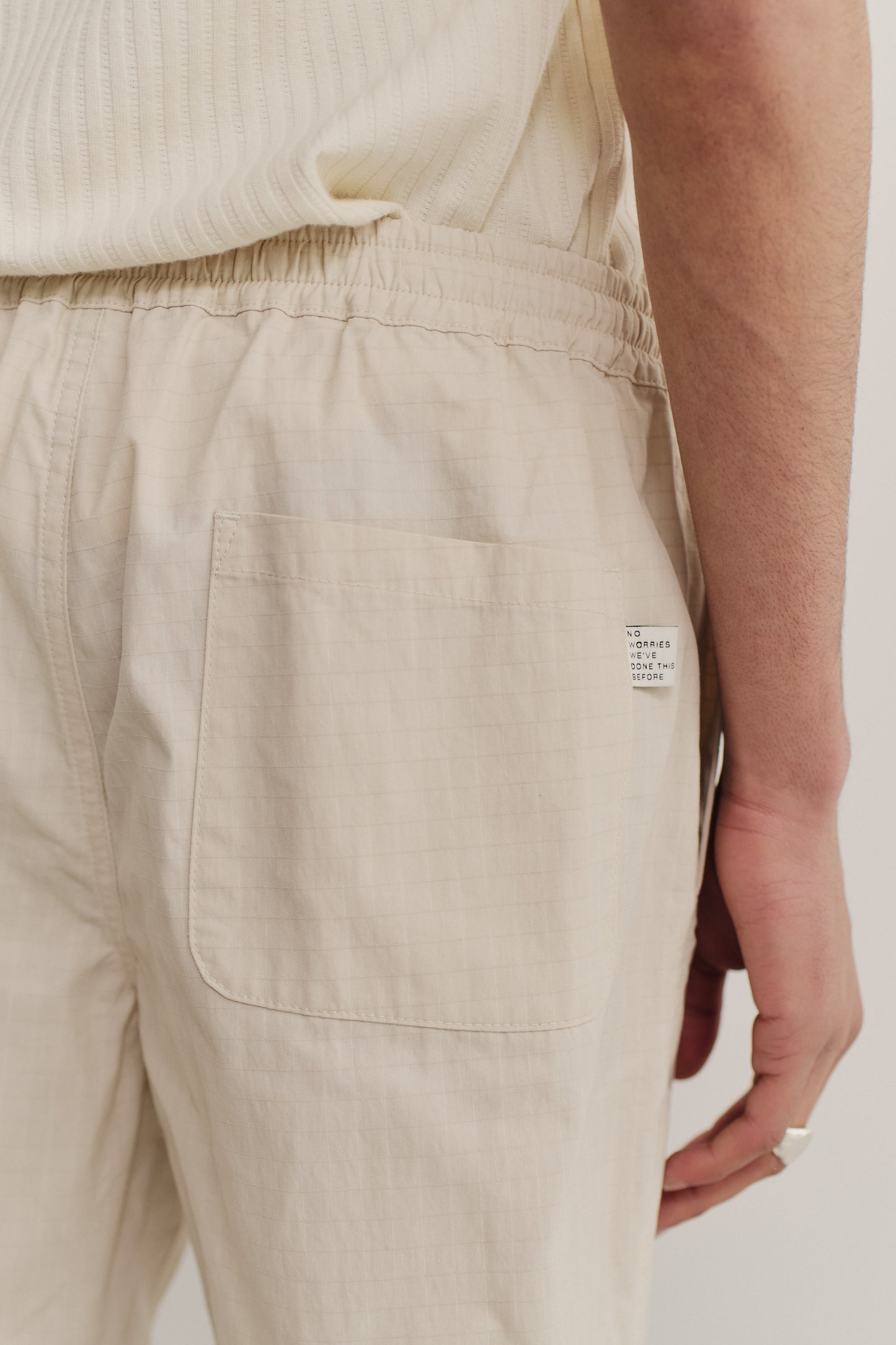 Men's shorts, cotton blend ripstop, beige, with elastic waist and back patch pocket.