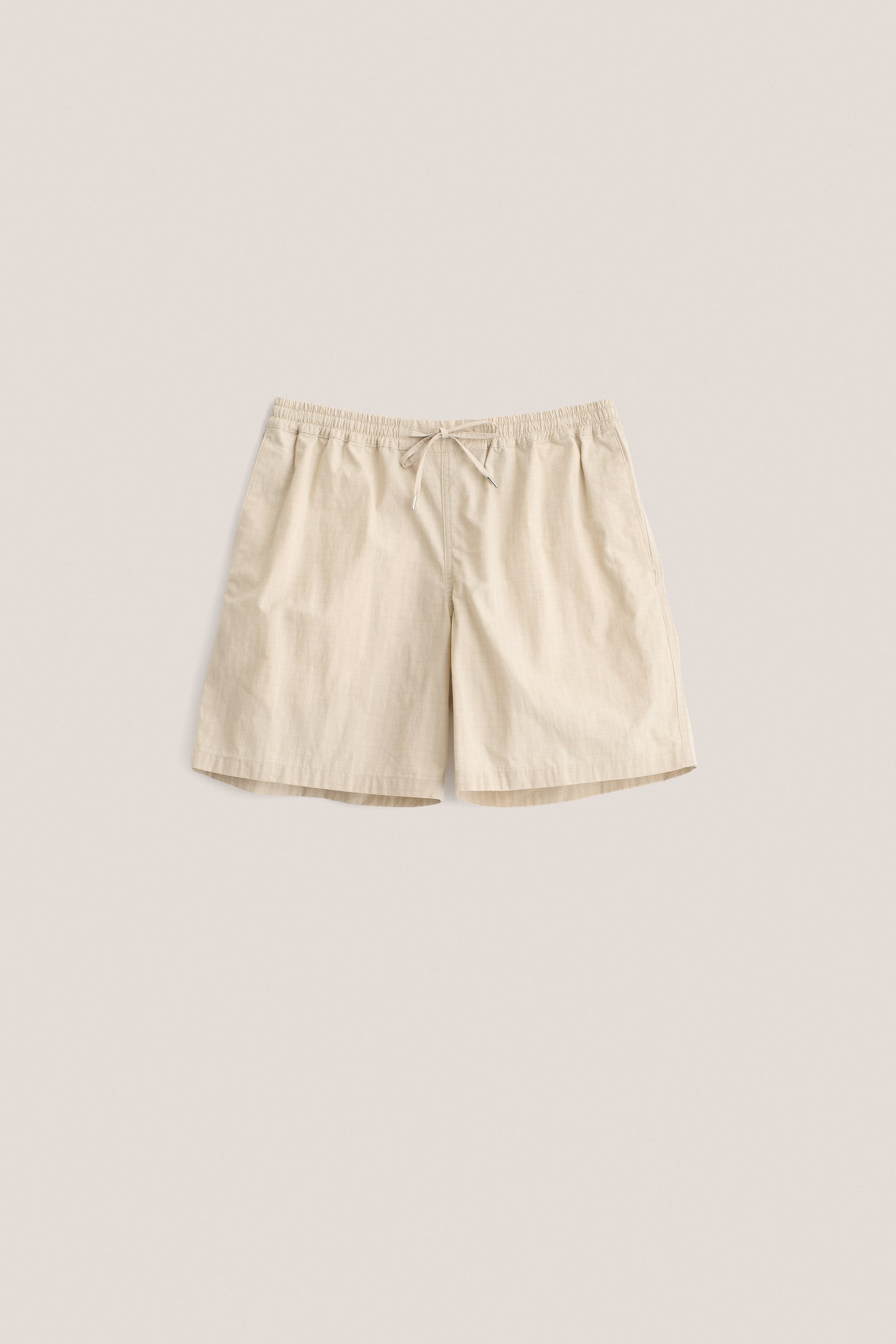 Men's shorts, cotton blend ripstop, waxed finish, beige, with elastic waist and pull cords.