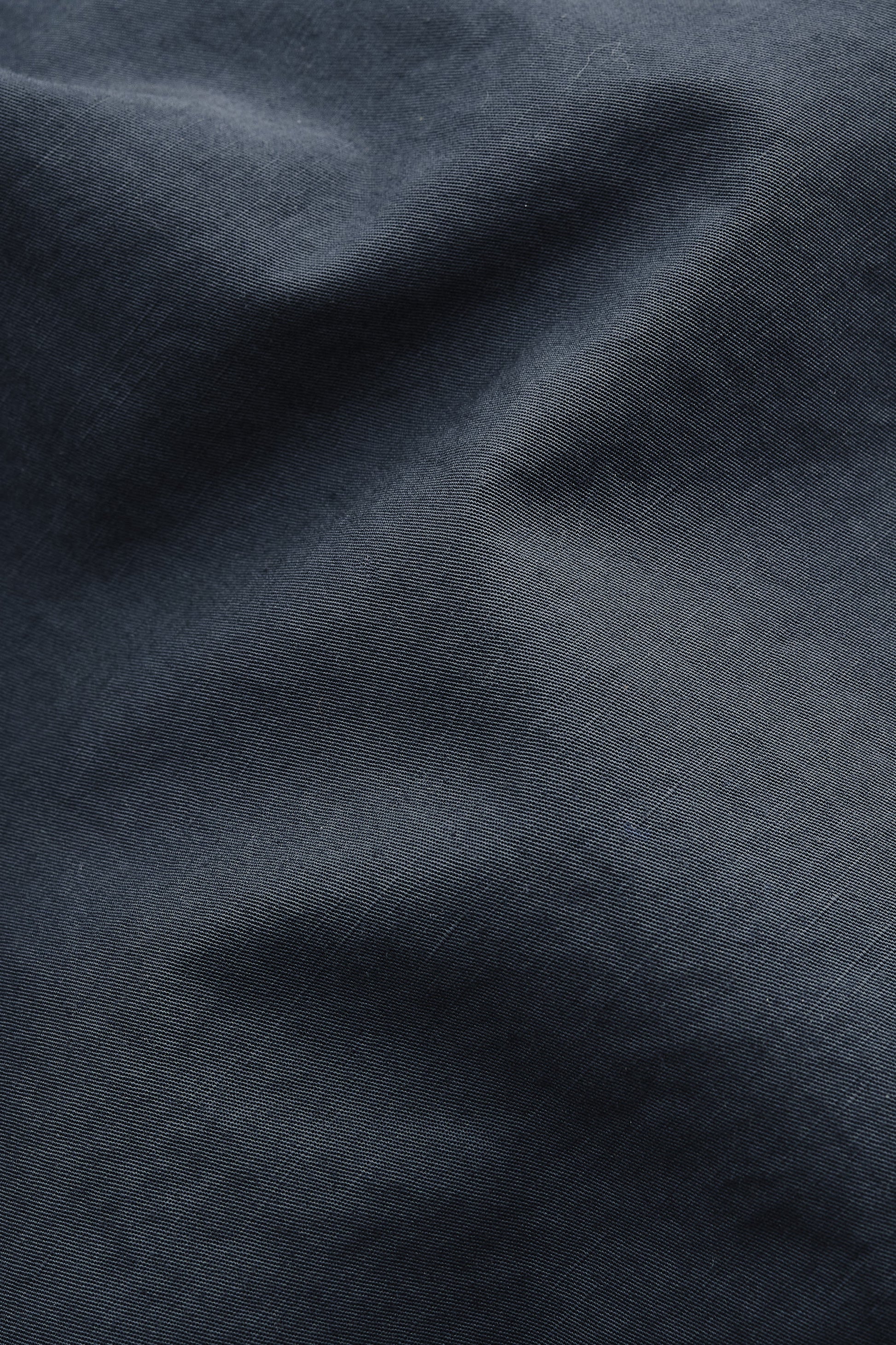 Men's shorts, cotton-linen blend, garment dyed navy, with natural structure and soft hand feel.